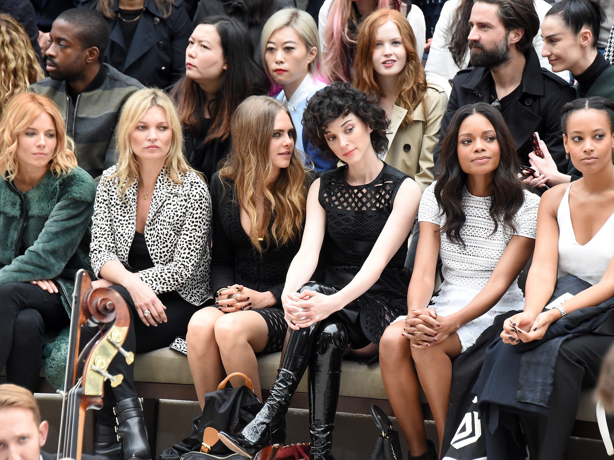 LONDON, ENGLAND - SEPTEMBER 21: Sienna Miller, Kate Moss, Cara Delevingne, St Vincent, Naomie Harris and guest attend the Burberry Womenswear Spring/Summer 2016 show during London Fashion Week at Kensington Gardens on September 21, 2015 in London, En