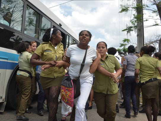 Cuban policewomen remove dissidents in Havana on March