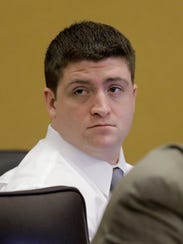 Cleveland police officer Michael Brelo listens to testimony