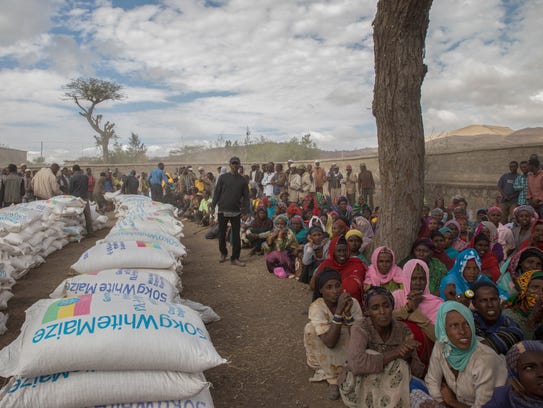 Residents of the Ziway Dugda district of Ethiopia wait