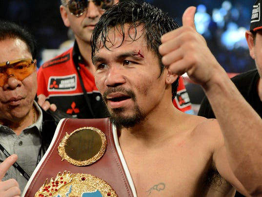 041214-manny-pacquiao-with-belt