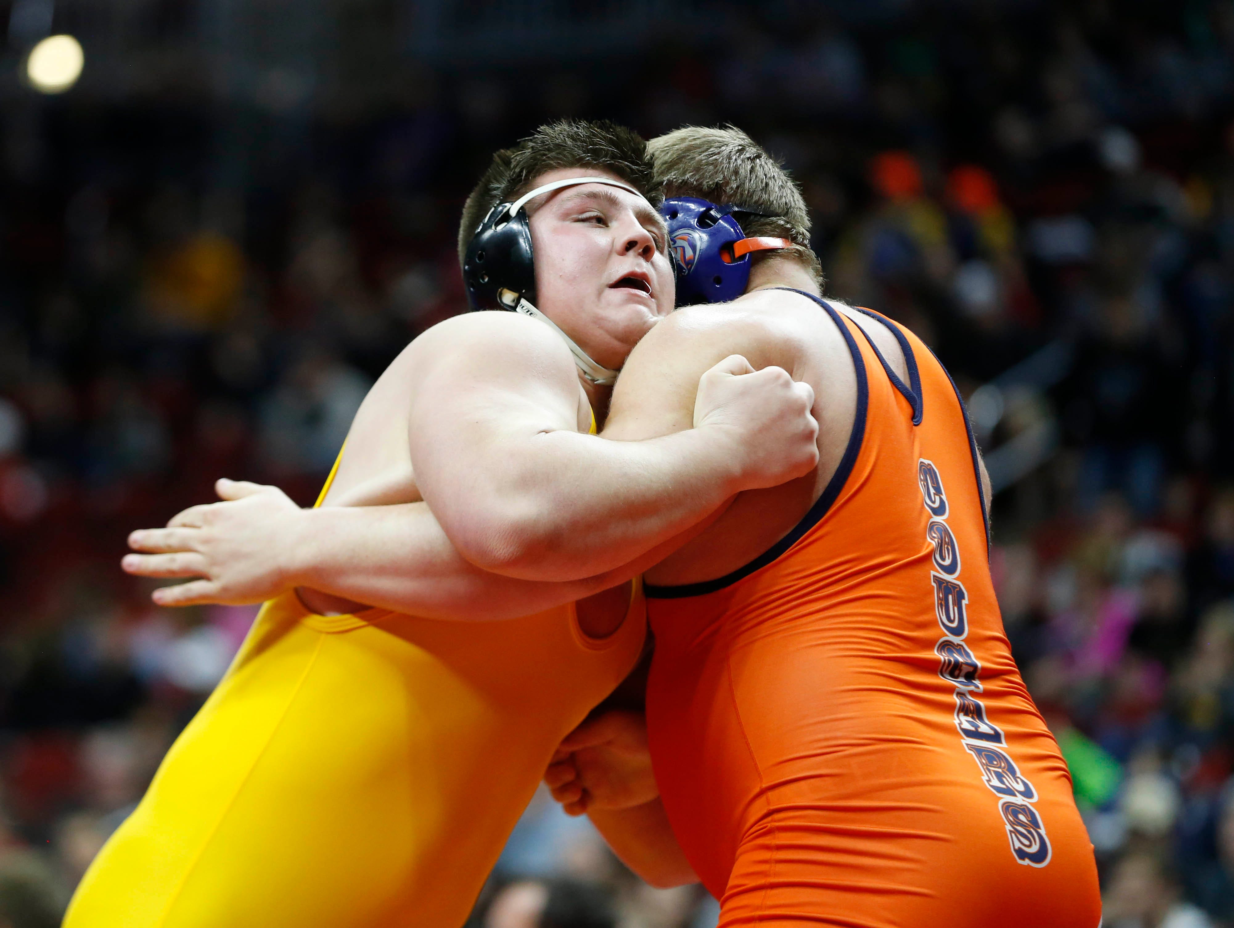 Manson Northwest's Tim Butcher (right) wrestles Regina's Jared Brinkman Saturday, Feb. 20, 2016 during the class 1A state wrestling tournament finals in Des Moines.