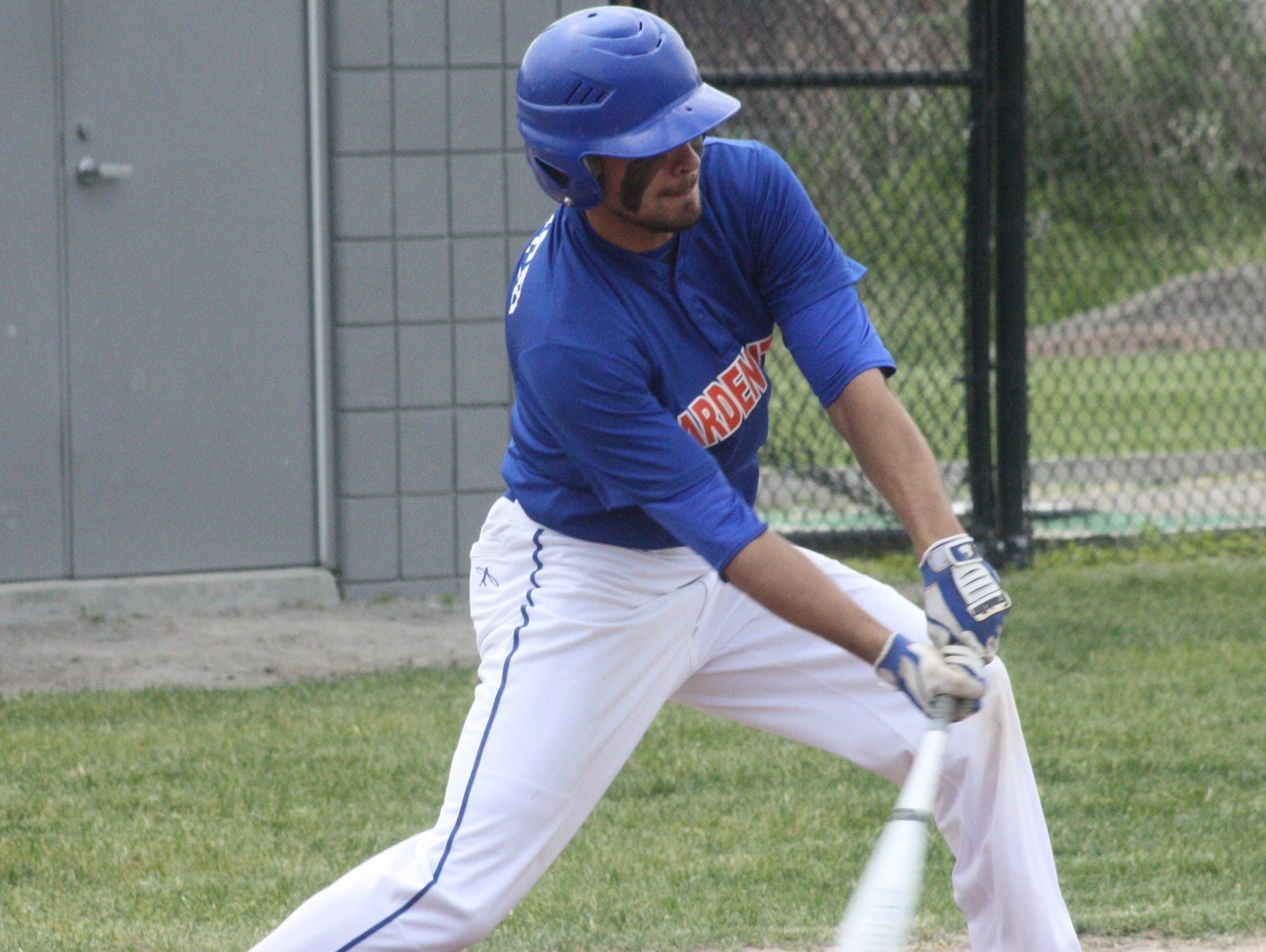 Garden City's Matt Kindred gets his bat on a low pitch Saturday morning.
