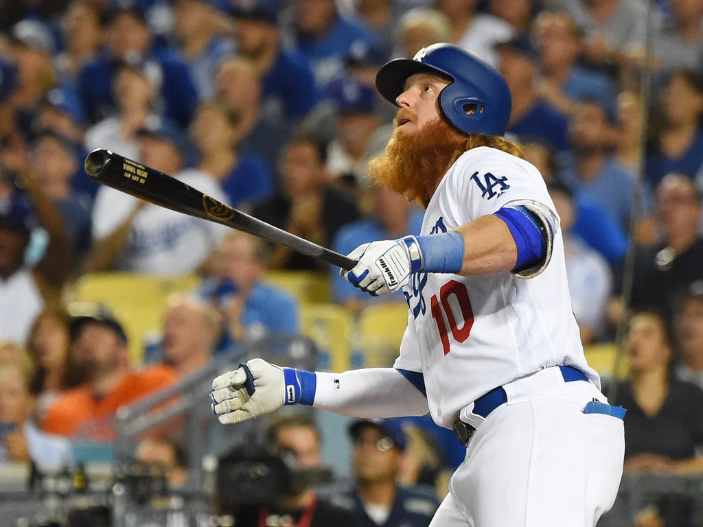 Los Angeles Dodgers third baseman Justin Turner hits a two-run home run against the Houston Astros in the sixth inning of Game 1 of the World Series at Dodger Stadium in Los Angeles.