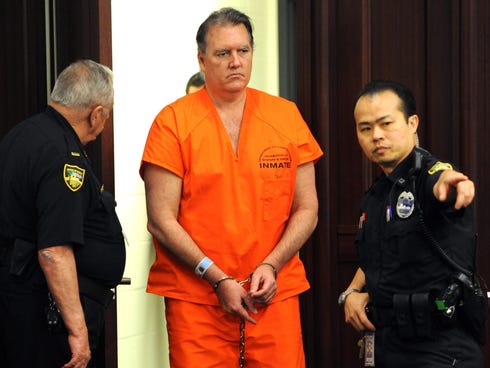 Michael Dunn is brought into the Duval County Courthouse in Jacksonville, Fla., for a hearing on Aug. 15, 2013.