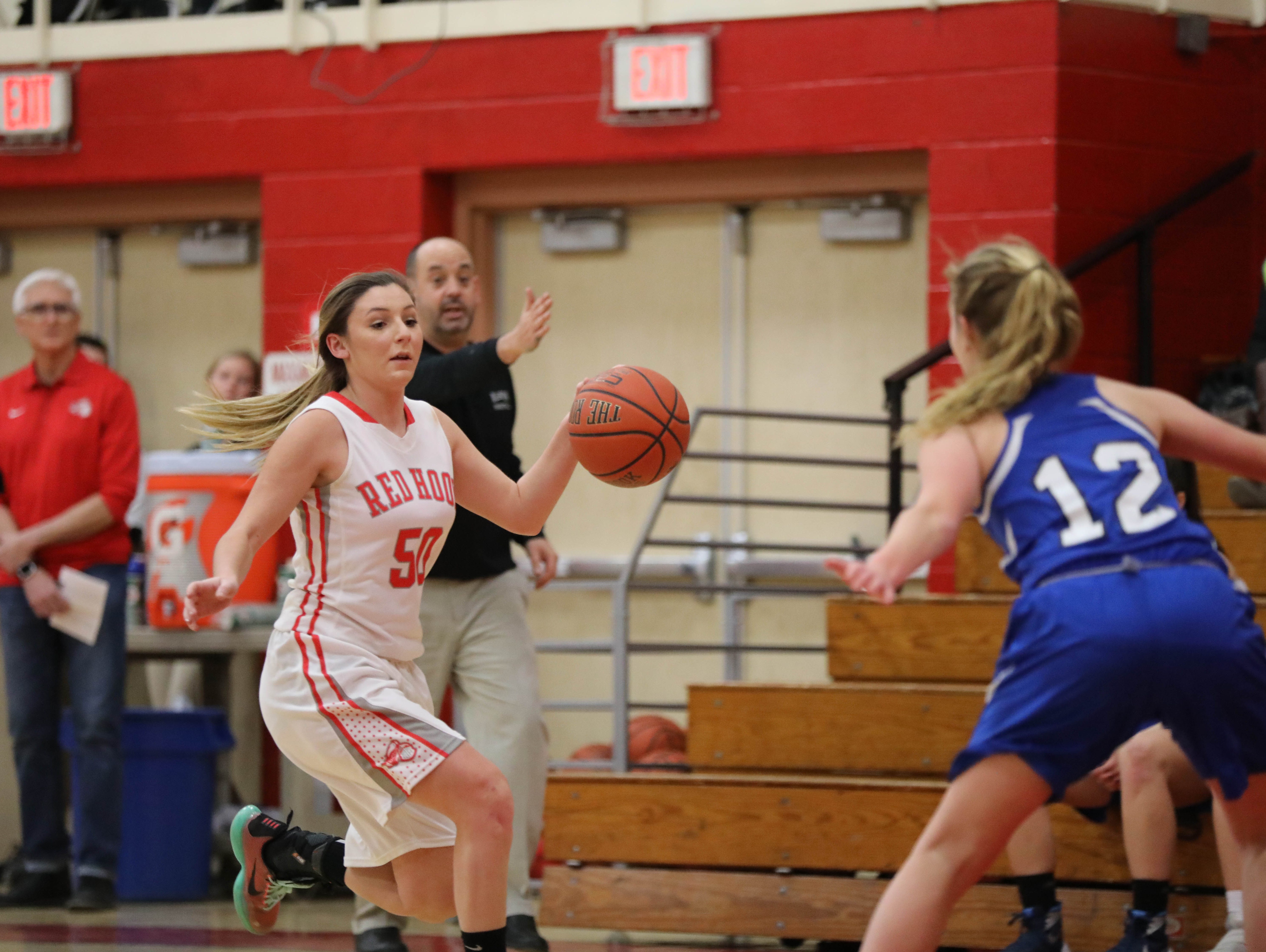 Red Hook's Jessica Wilkinson (left) dribbles up the court during a game against Millbrook on Monday, January 30th, 2017.