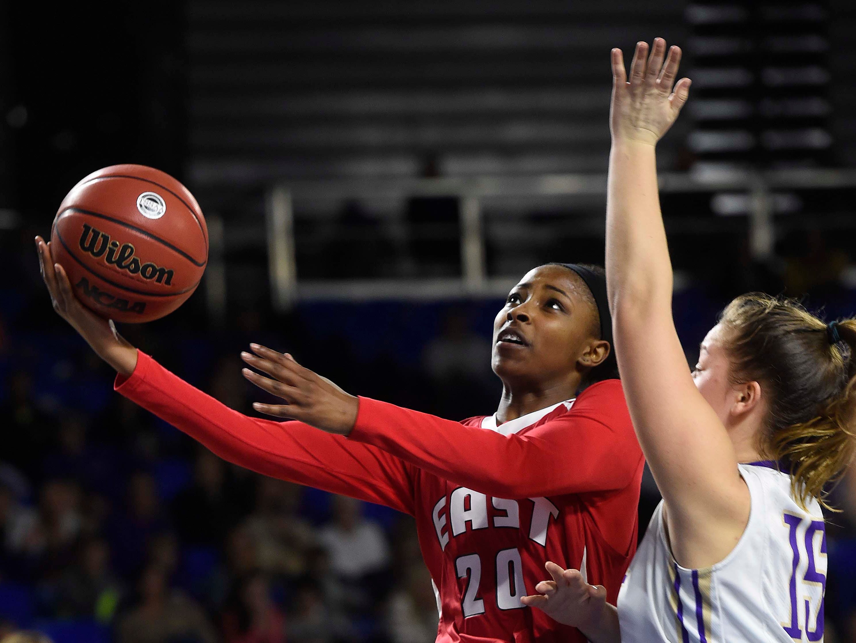 East's Erica Haynes-Overton (20) shoots for two of her 16 points around CPA's Addie Russell Omer (15) as East Nashville wins 47-35 in the Division I Class AA Girl's basketball tournament at the Murphy Center on MTSU's campus March 10, 2016 in Murfreesboro, Tenn.