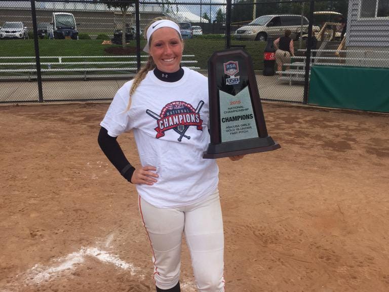 Glen Este’s Brooke Parker shows off the winning tournament trophy in Portland, Oregon. Parker is next off to Bowling Green to play softball.