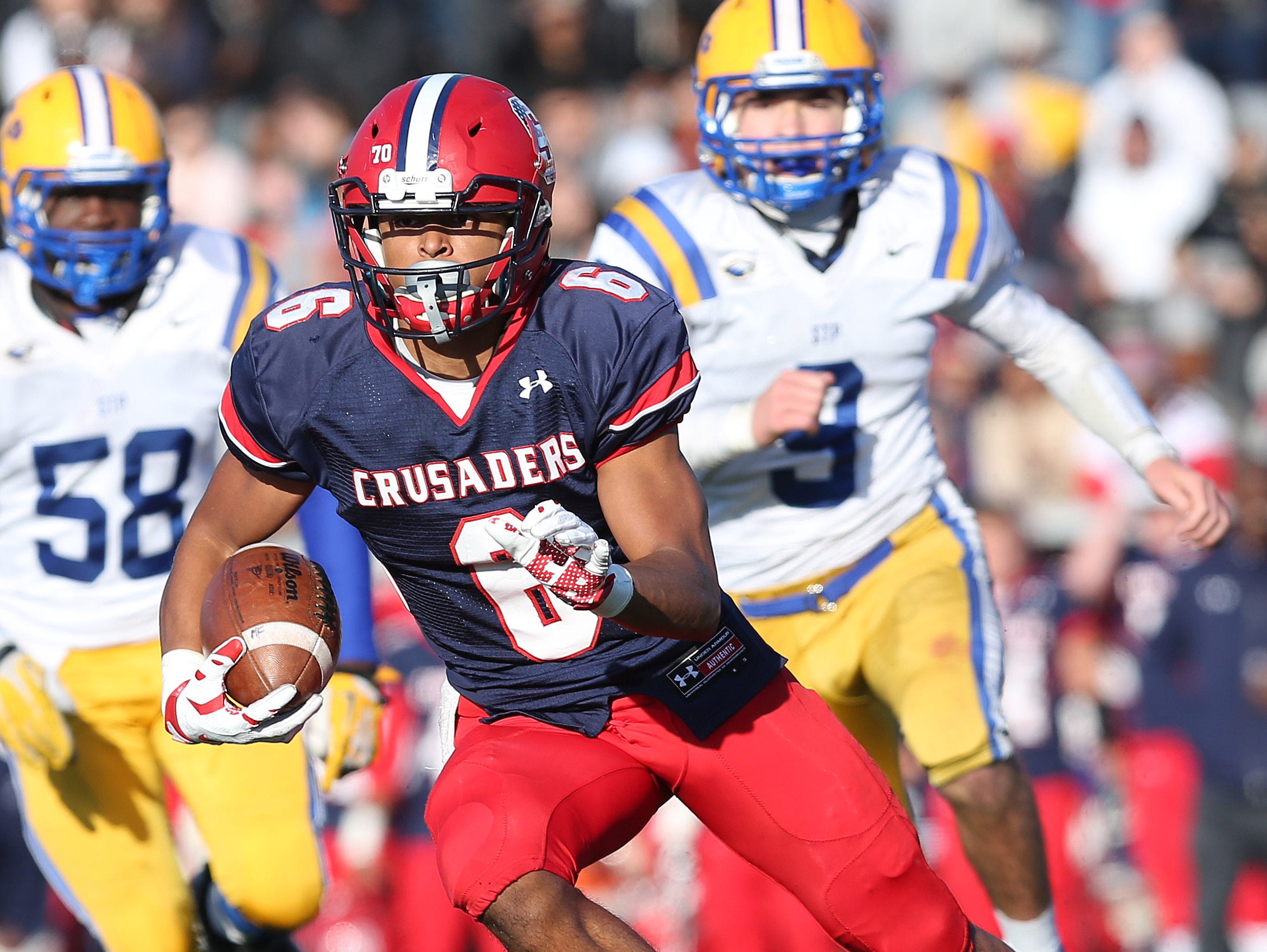 Stepinac's Terrell Morrison (6) finds some room in the Saint Peter's defense as he runs for a 3rd quarter touchdown during the NYCHSFL semifinals at Archbishop Stepinac High School in White Plains Nov 15, 2015. Stepinac won the game 49-7.