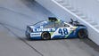 Jimmie Johnson hits the inside wall after losing control