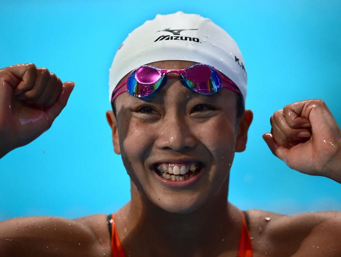 Japan's Kanako Watanabe celebrates after winning the