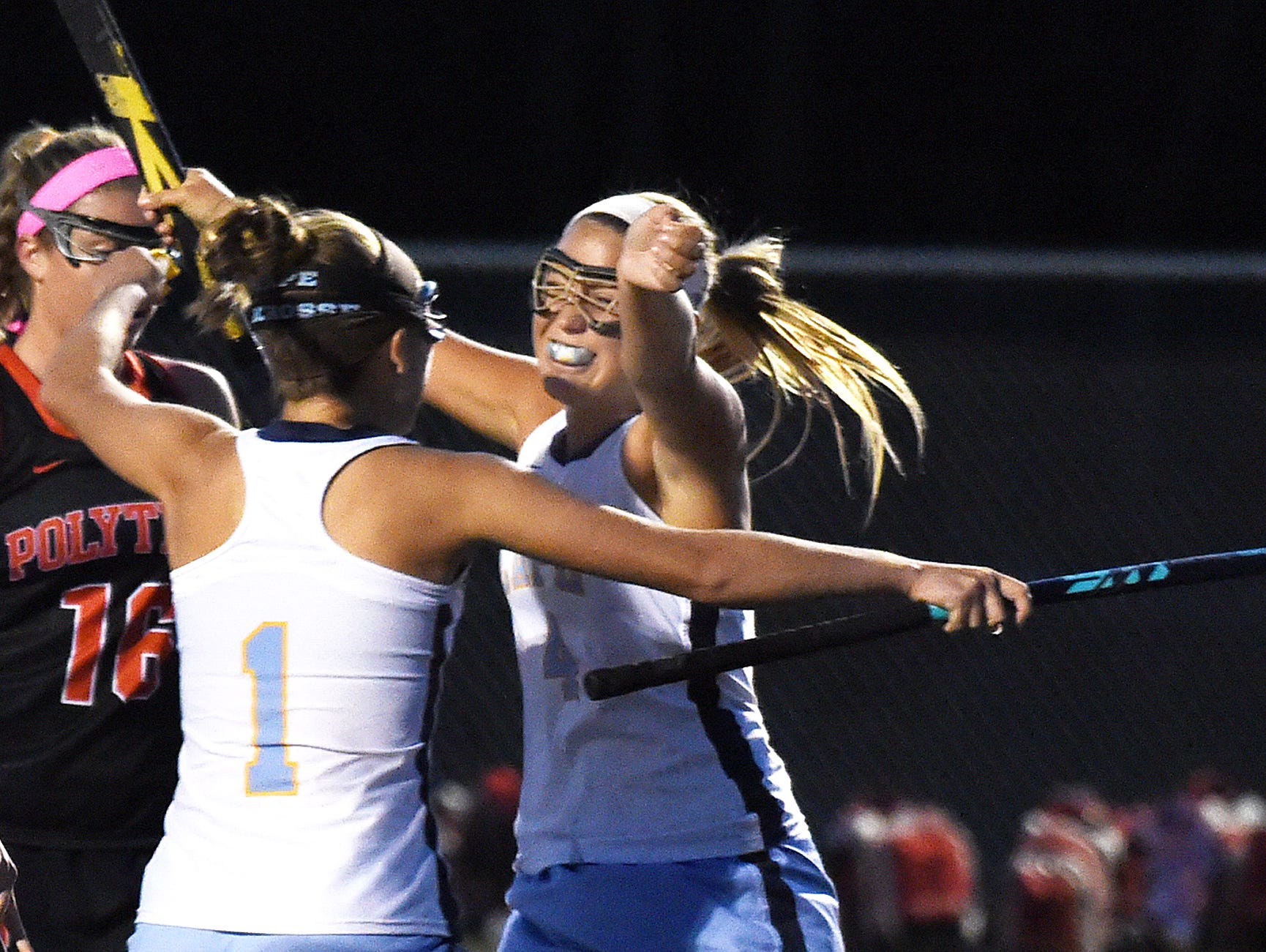 Capes Sydney Ostroski celebrates after scoring as Cape Henlopen HS (white) hosted Polytech HS (black) in Varsity Field Hockey at Champions Stadium at the school near Lewes on Thursday October 22.