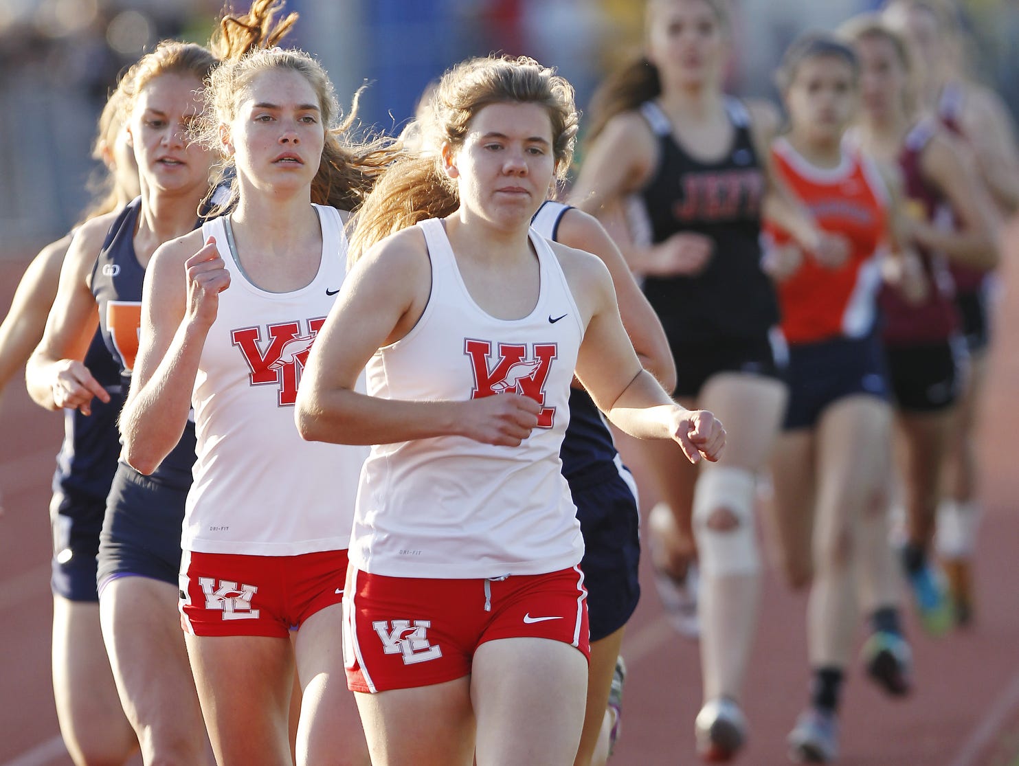 Action from the 800 meter run during the girls track sectional Tuesday, May 19, 2015, at Harrison High School.