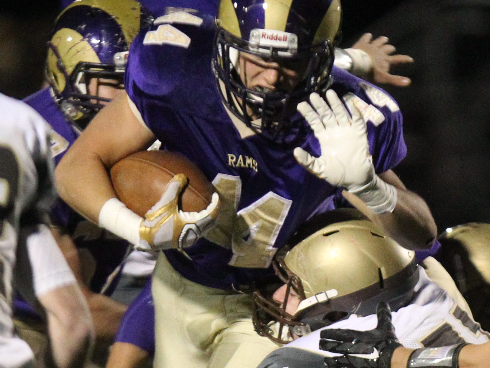 Clarkstown North's Michael Porco is tackled by Clarkstown South's Vince Maraia during their Class AA quarterfinal at Clarkstown North Oct. 23, 2015. 51