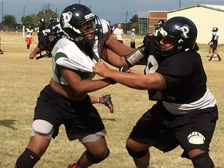 Parkway's Nick So'oto (right) wrestles with Preston Hall during practice on Tuesday at the school.