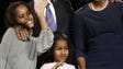 Then-presidential hopeful Barack Obama waves to supporters