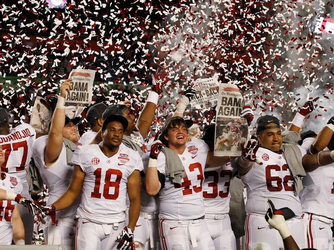 Alabama players celebrate after the BCS National Championship college football game against Notre Dame Monday, Jan. 7, 2013, in Miami. Alabama won 42-14. (AP Photo/Wilfredo Lee)  ORG XMIT: BCS210