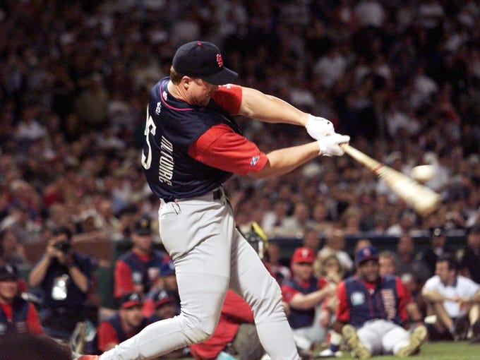 Mark McGwire, Fenway Park, 1999: Following his single-season home run record of 70, McGwire blasted 13 home runs over the Green Monster in the first round &mdash; a record at the time. He eventually lost to Ken Griffey Jr., but not after an iconic moment when he nearly broke the light tower in a classic Roy Hobbs moment.