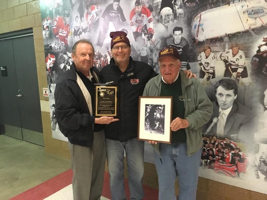 Chaz Demm of the U.S. Hockey Hall of Fame (left) and