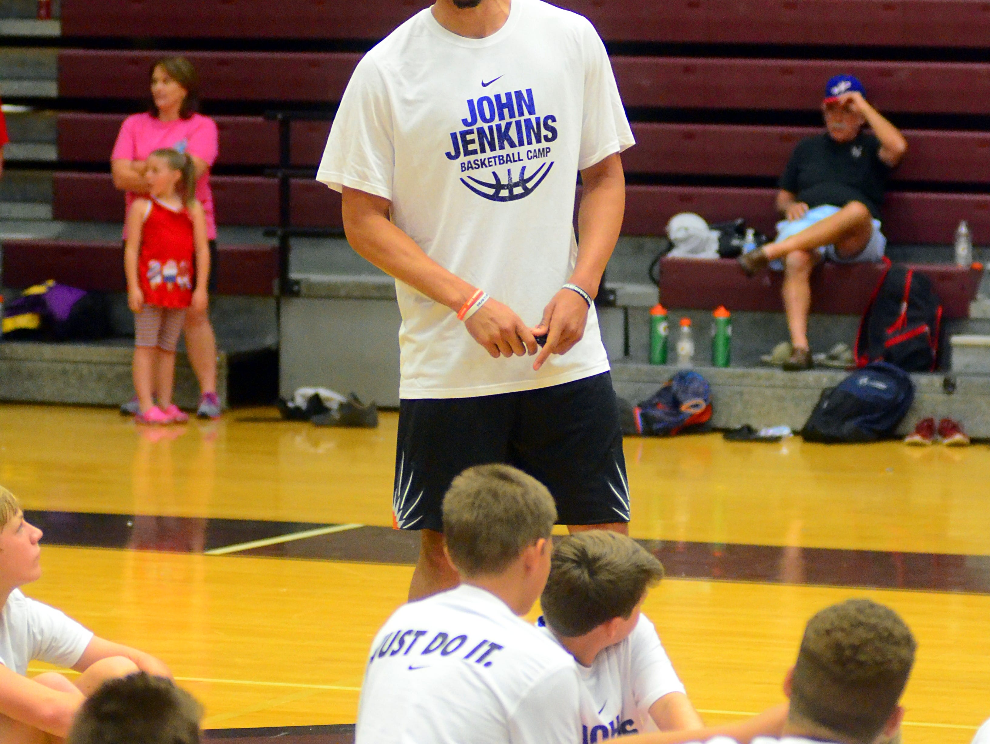 Jenkins speaks to campers following the conclusion of Friday’s session of his fourth annual basketball camp at Station Camp High School.