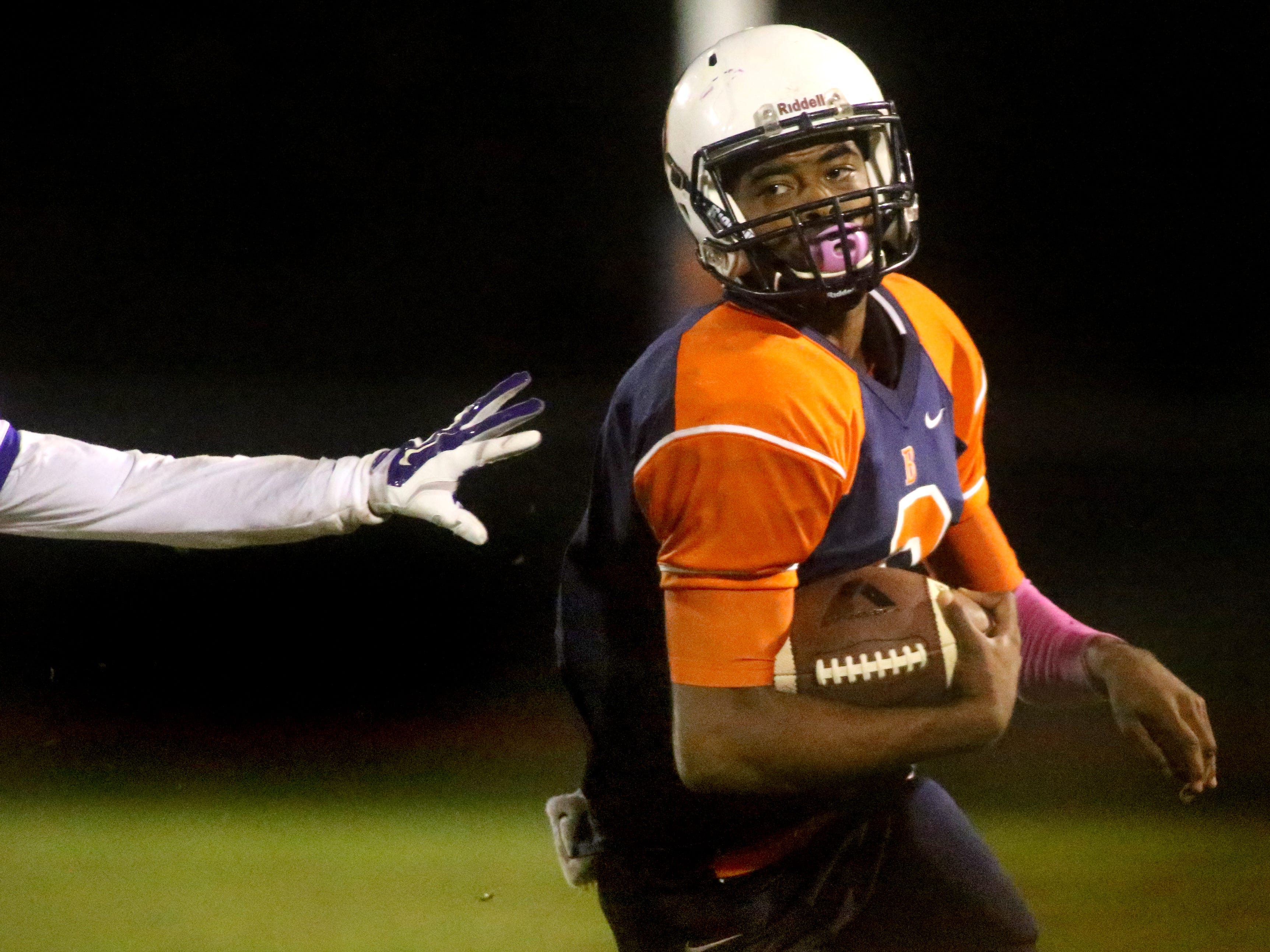 Blackman's quarterback Jauan Jennings runs down the sidelines as he gets pushed out of bounds during the game against Smyrna at Blackman, on Friday, October 17, 2014.
