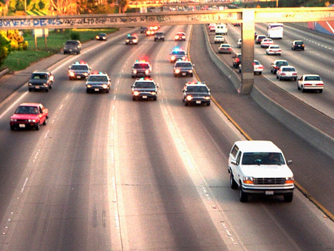 <p>Police chase a Ford Bronco driven by Al Cowlings as he takes his friend, O.J. Simpson, to Simpson's home in Brentwood. The slow-moving June 17, 1994, freeway chase took law enforcement authorities through two counties after Simpson was charged with the murders.</p>
