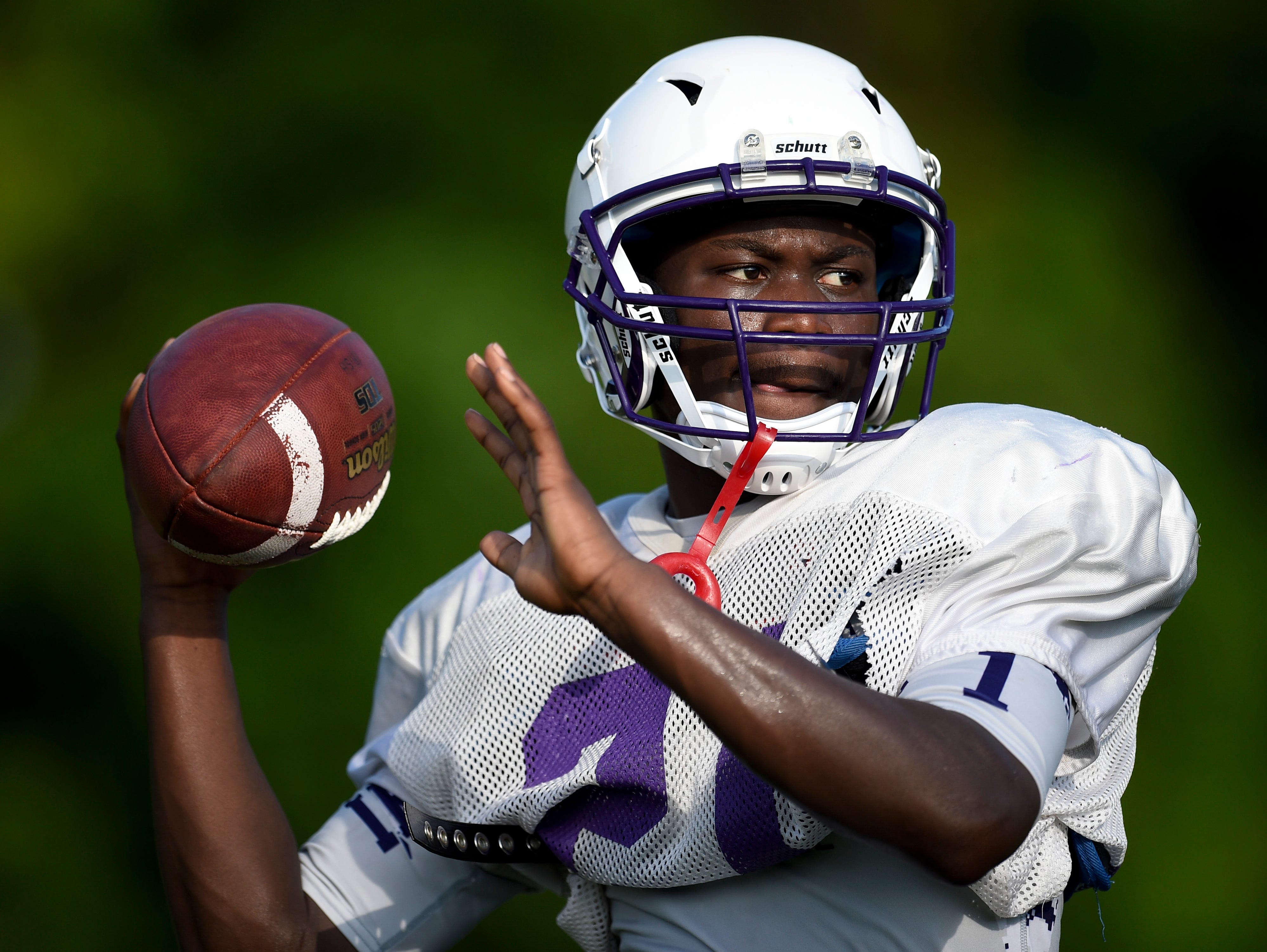Father Ryan's Elton Nkwembe (21) throws during practice at Father Ryan High School, Monday, July 25, 2016, in Nashville, Tenn.