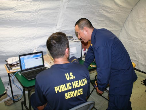 Lt. Shane Deckert and CDR David Lau at work inside