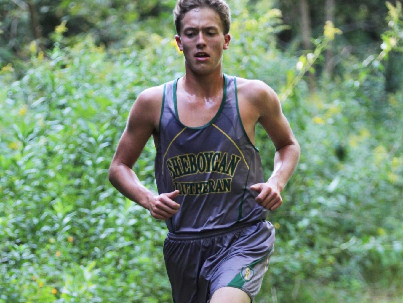 Sheboygan Lutheran cross country runner Lucas Parmley is spotlighted.