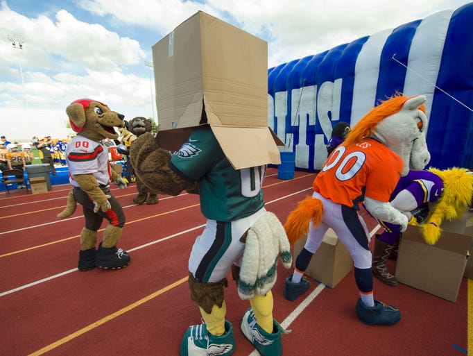 Mascots vs. peewees at Carmel High School