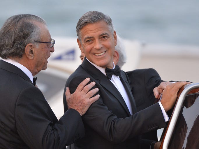 George Clooney boards an Italian water taxi for his wedding at Venice's16th-century Palazzo Cavalli, leaving his bachelor days in his wake. Check out the scene at his Saturday wedding to British lawyer Amal Alamuddin.