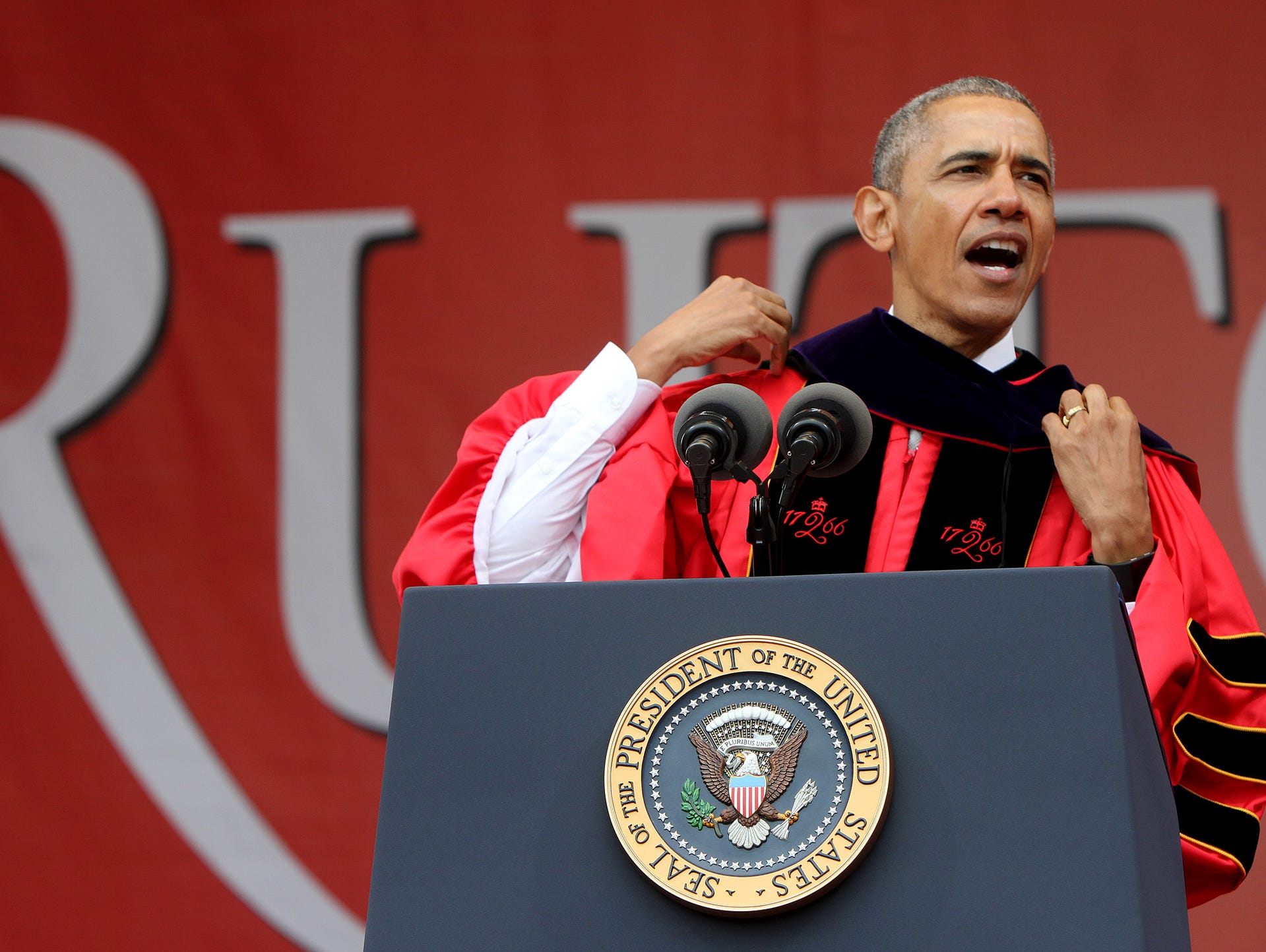 President Barack Obama adjusts his Honorary Doctor