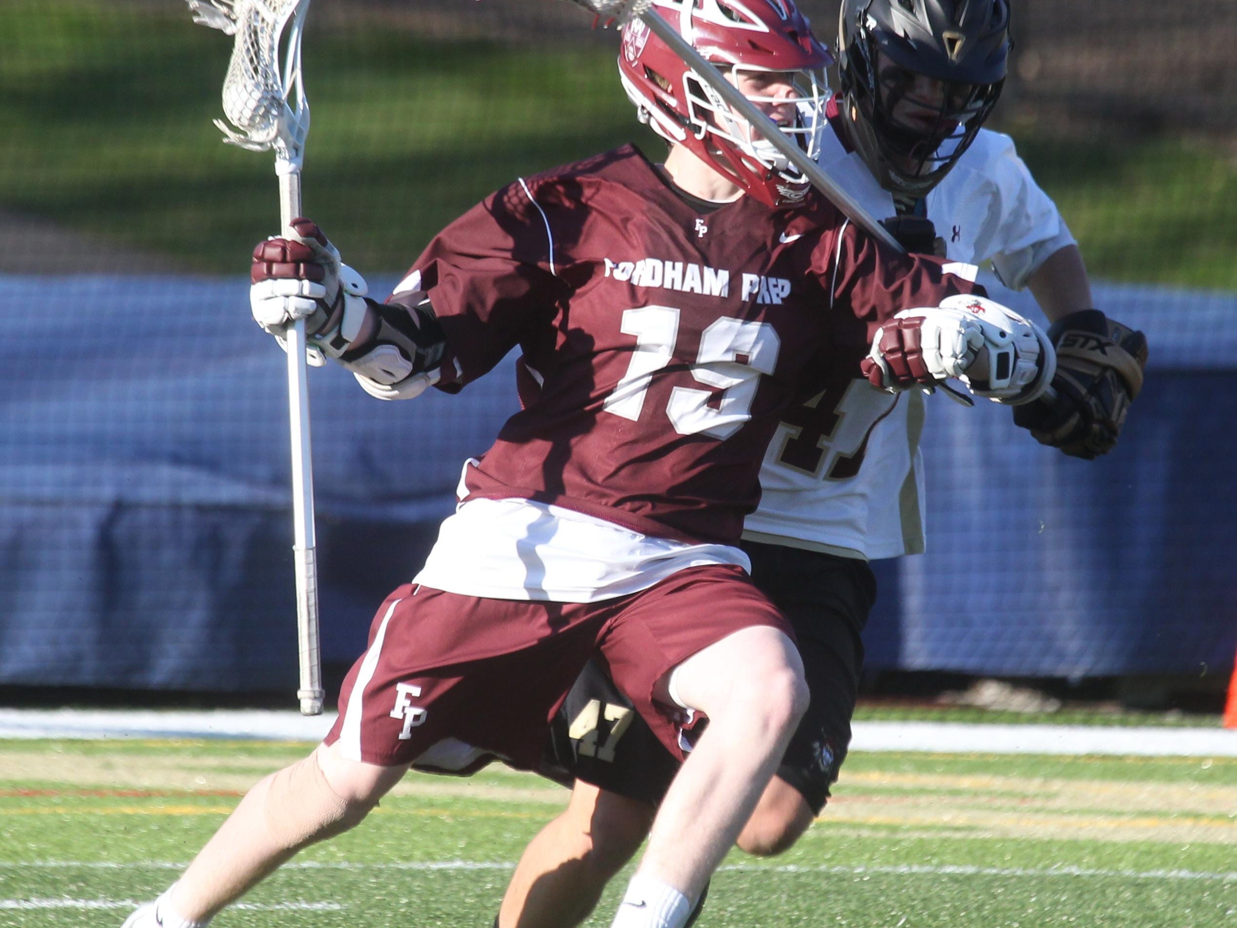 Fordham Prep’s Ryan Gilchrist is pressured by Iona Prep’s Keith Bonci during their game at Iona Prep on Friday. The Rams won 8-7.