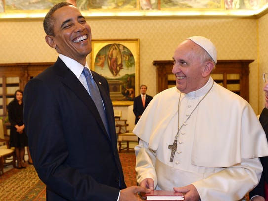Pope Francis and President Obama exchange gifts at