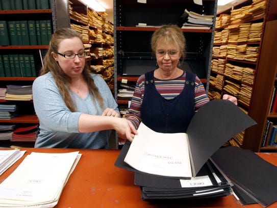 Christina Eaton, associate librarian, left, and Mary