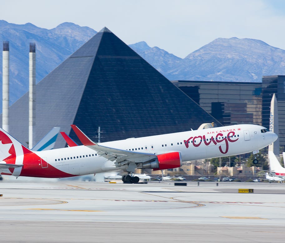 A rouge Boeing 767 leaves the warm climate Las Vegas, bound for Toronto, on February 15, 2016.