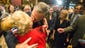 Bush kisses JoAnn Wiegand, one of the founding members
