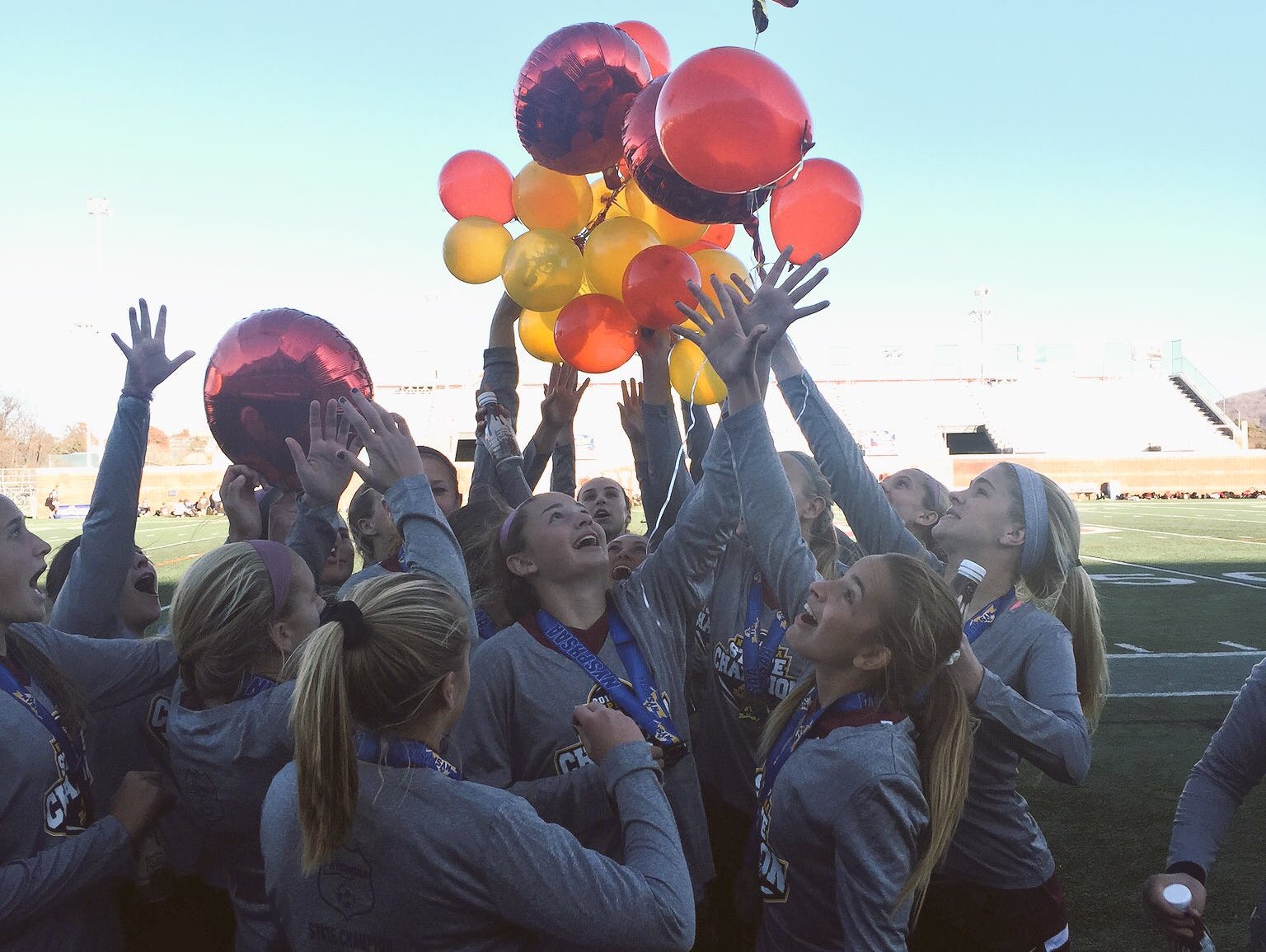 In celebration of its state title, Arlington released colorful balloons over the field.
