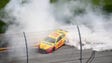 Joey Logano performs a burnout after winning the season-opening