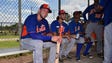 Sept. 20: Tim Tebow sits with teammates in the dugout.