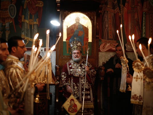 The Orthodox Christian priest heads the celebration of