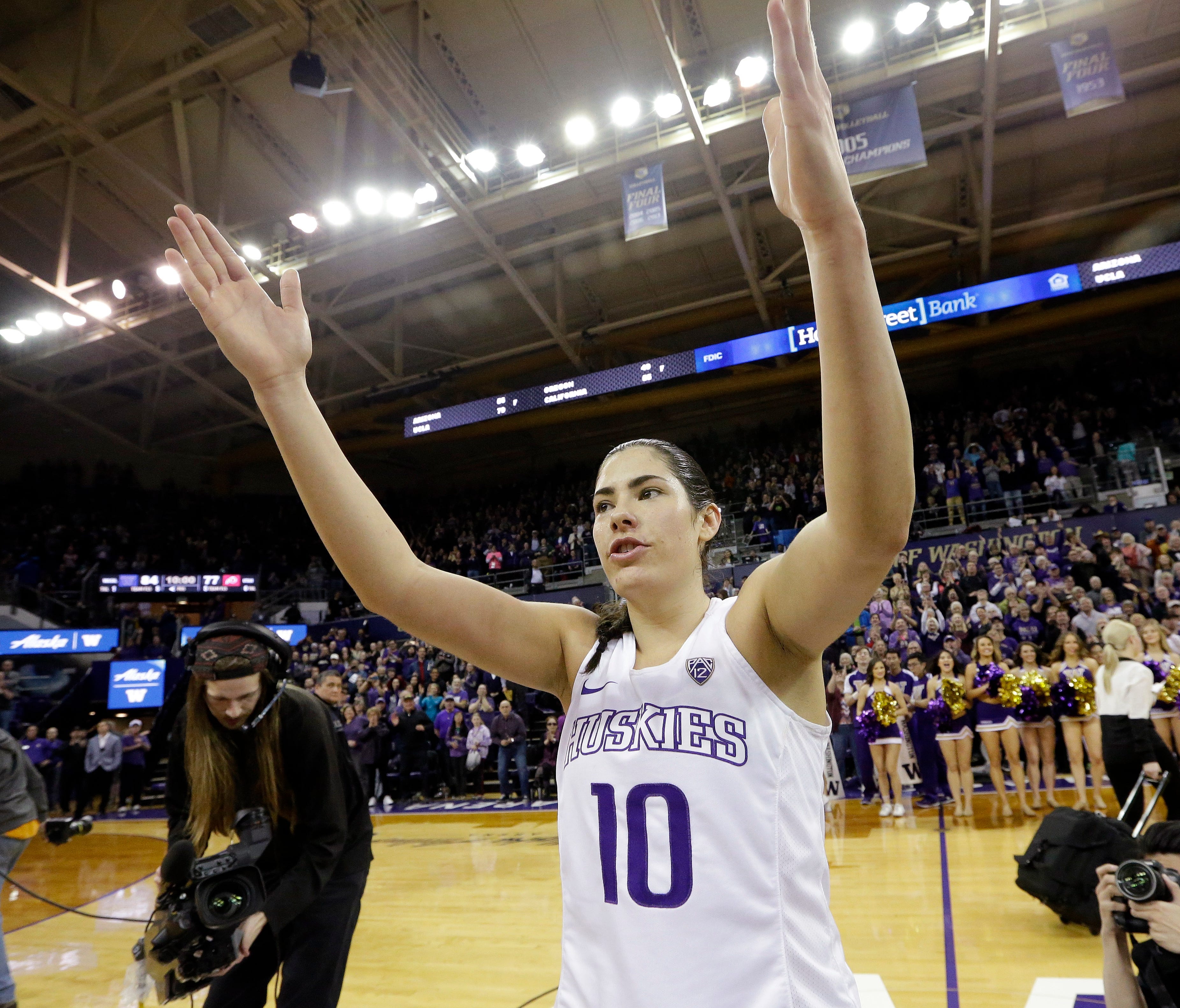 Kelsey Plum salutes the crowd after breaking the women's all-time scoring record.