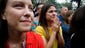 Family members watch as New York Governor Andrew Cuomo