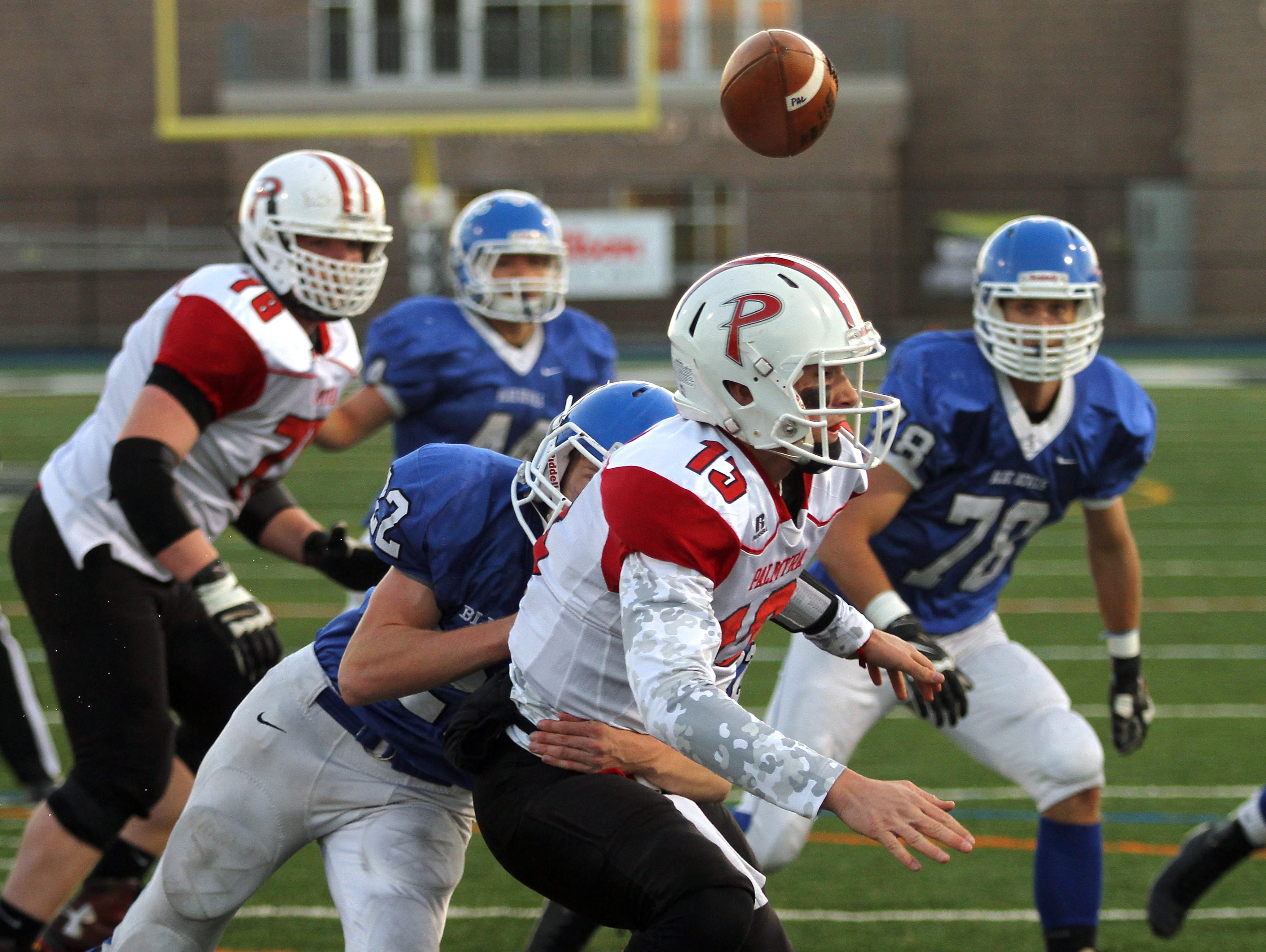 Shore Regional's Alex Johnson hits Palmyra quarterback Max Smyth fumbling the ball into the end zone recovered by Shore for a first half touchdown during the NJSIAA Central, Group 1 Championship game at Kean University Alumni Stadium. December 5, 2015, Union, NJ.
