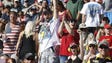 Fans cheer on their cars during the NASCAR Sprint Cup