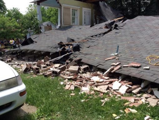 Four workers escaped from a house that collapsed in