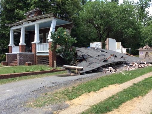 Four workers escaped from a house that collapsed in