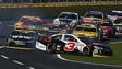 Round 2: Austin Dillon is bumped onto the grass by