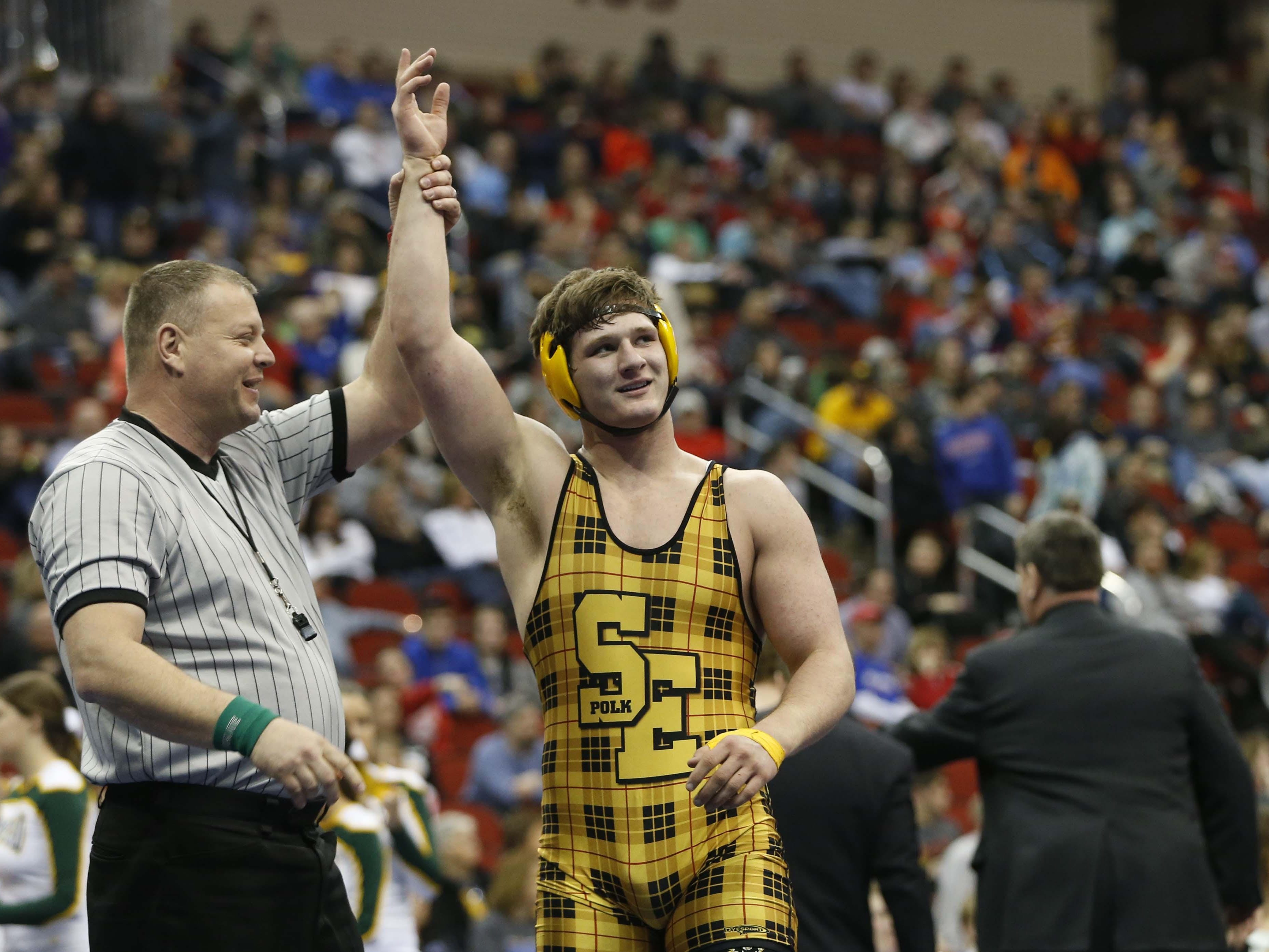 Southeast Polk's Ethan Andersen celebrates his win in the finals of the 3A-220 match Saturday, Feb. 21, 2015, at the State Wresting Tournament at Wells Fargo Arena in Des Moines.
