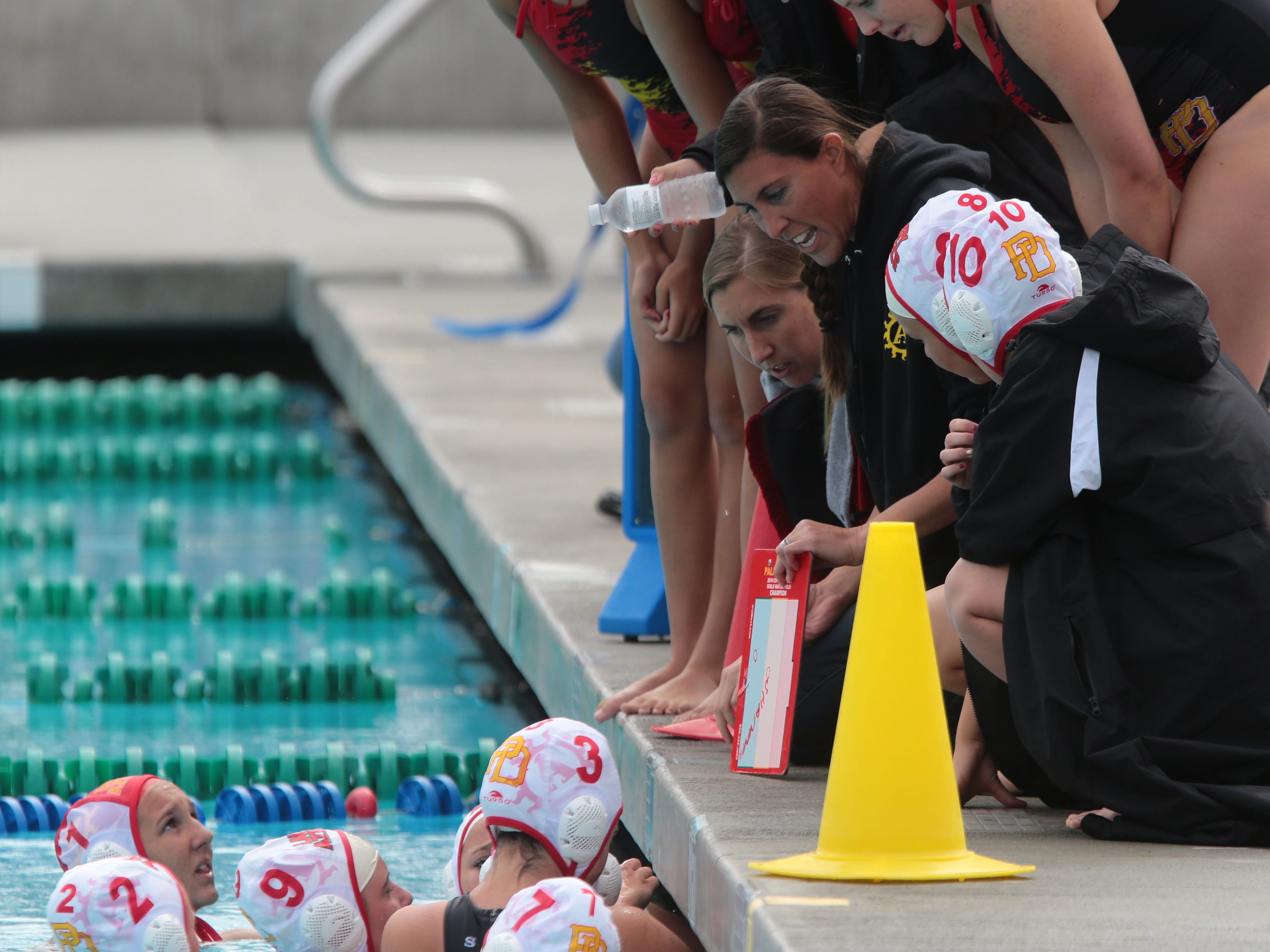 Palm Desert head coach Michelle Valovic talks to her team on Saturday during the CIF Southern Section Division 5 Girls Water Polo finals in Irvine. Palm Desert loss to Los Altos 8-7.